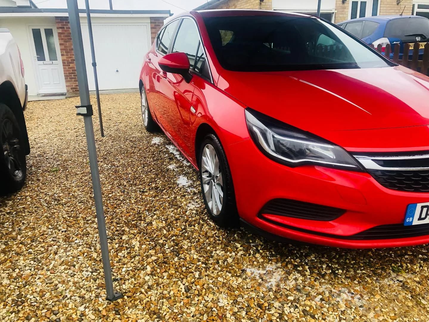 Red car photographed outdoors